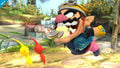 Wario chomping Olimar in Super Smash Bros. for Wii U.